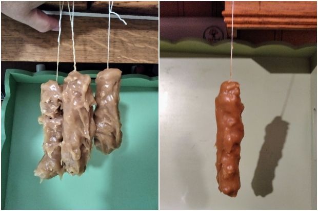 Βουτάμε 2-3 φορές την κλωστή με τα καρύδια σε πυκνή μουσταλευριά με κανέλα και κρεμάμε τα σουτζούκια απόένα πόμολο π.χ. με ένα πιάτο από κάτω για την περίπτωση που θα στάξει μέχρι να στεγνώσει (photo: Κική Τριανταφύλλη)